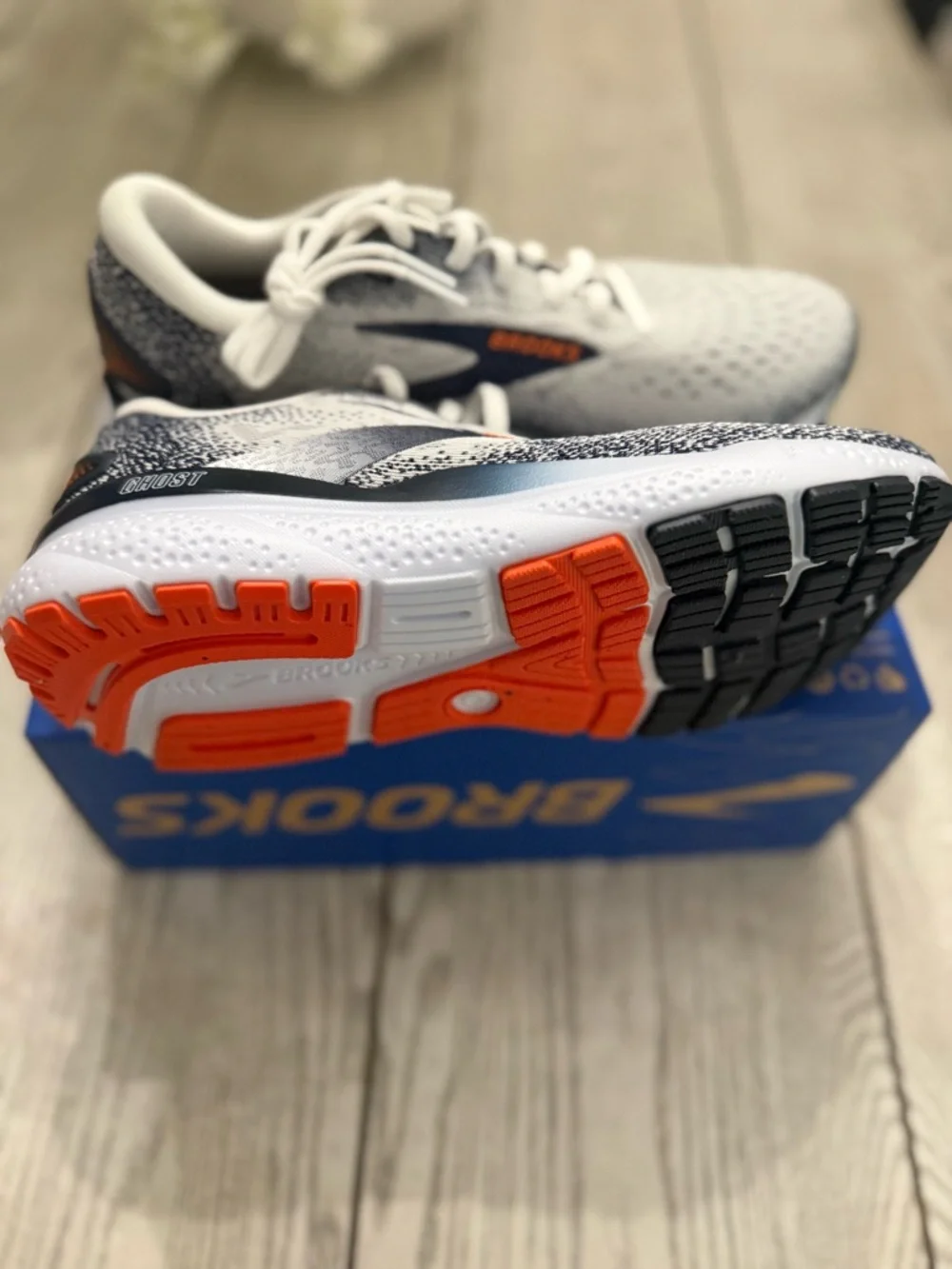 Brooks White and Navy Running Shoes with Orange Logo Accents